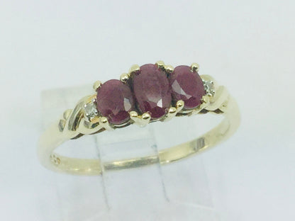 10k Yellow Gold Oval Cut Ruby July Birthstone Trinity & Diamond Ring