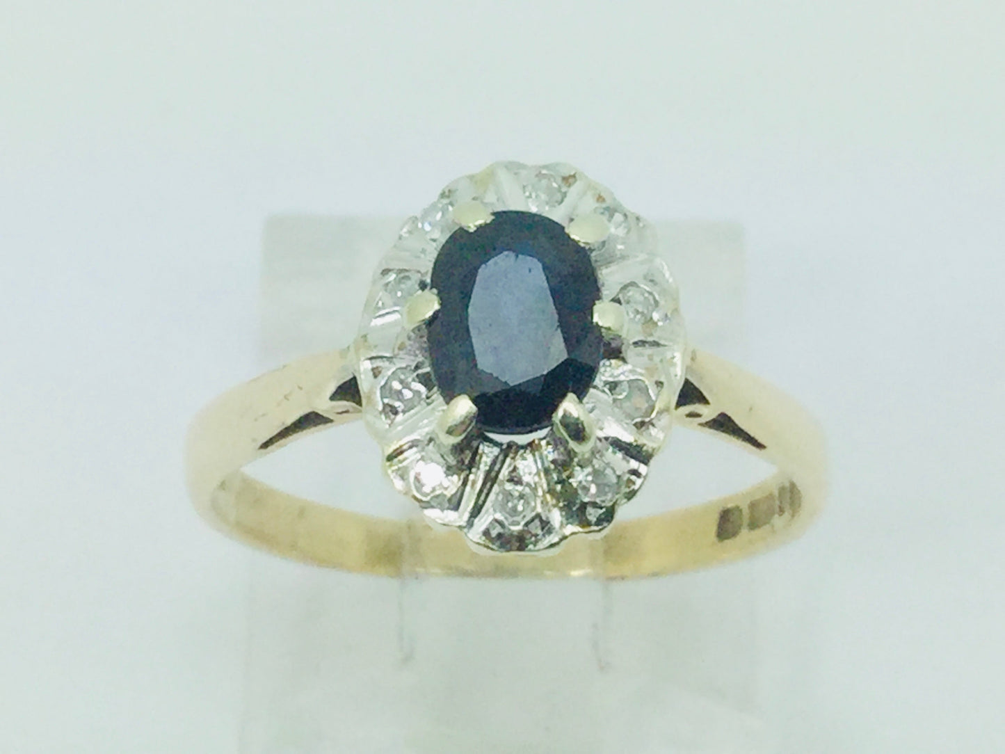 9k Yellow Gold Oval Cut 0.5ct Sapphire September Birthstone & 5pt Diamond Halo Ring