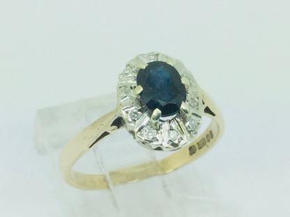 9k Yellow Gold Oval Cut 0.5ct Sapphire September Birthstone & 5pt Diamond Halo Ring