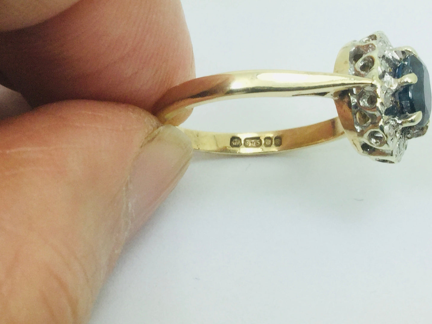 9k Yellow Gold Oval Cut 0.5ct Sapphire September Birthstone & 5pt Diamond Halo Ring