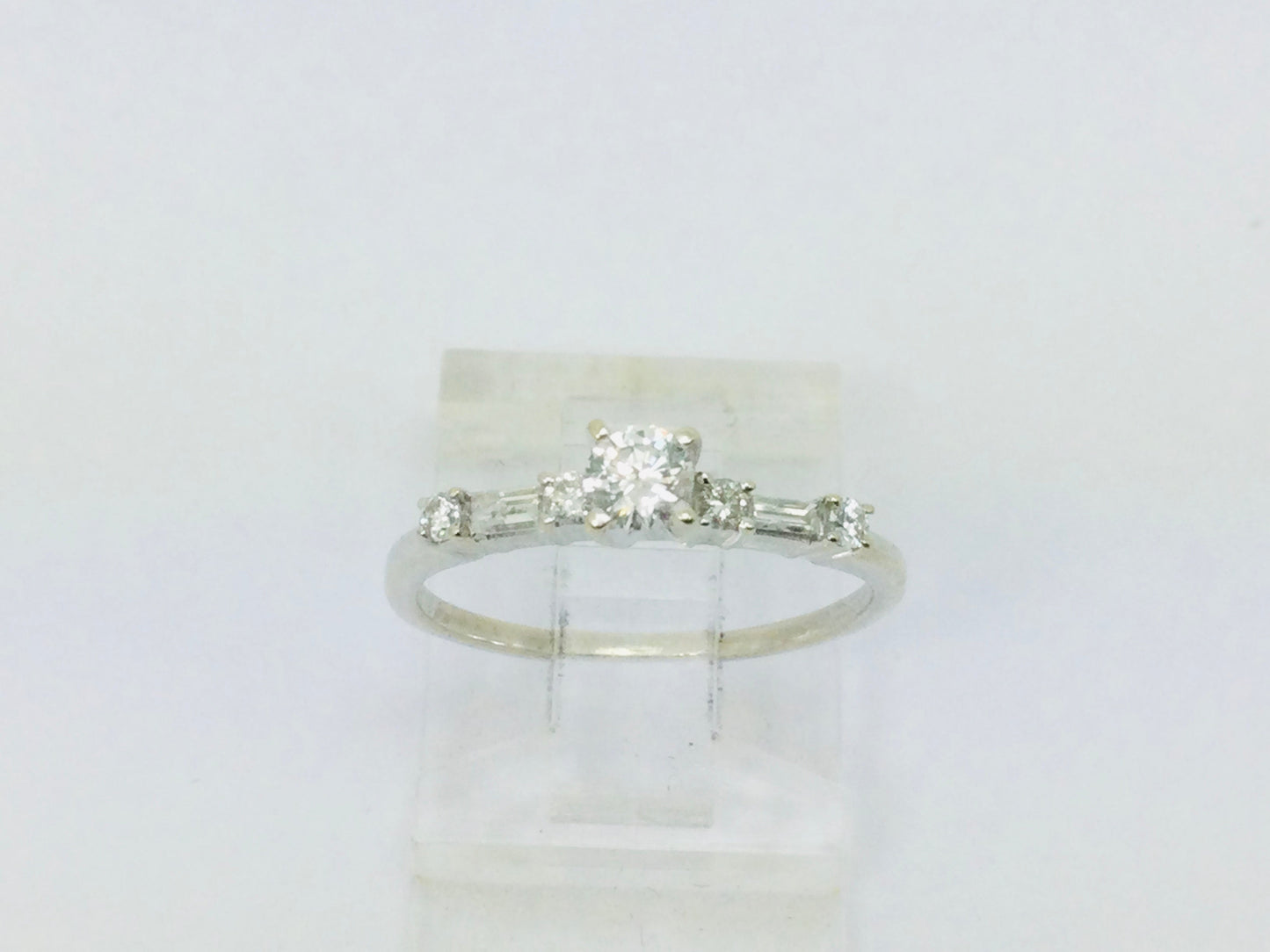 14k White Gold Round Cut 23pt Diamond with Round and Baguette Diamond Accents Ring
