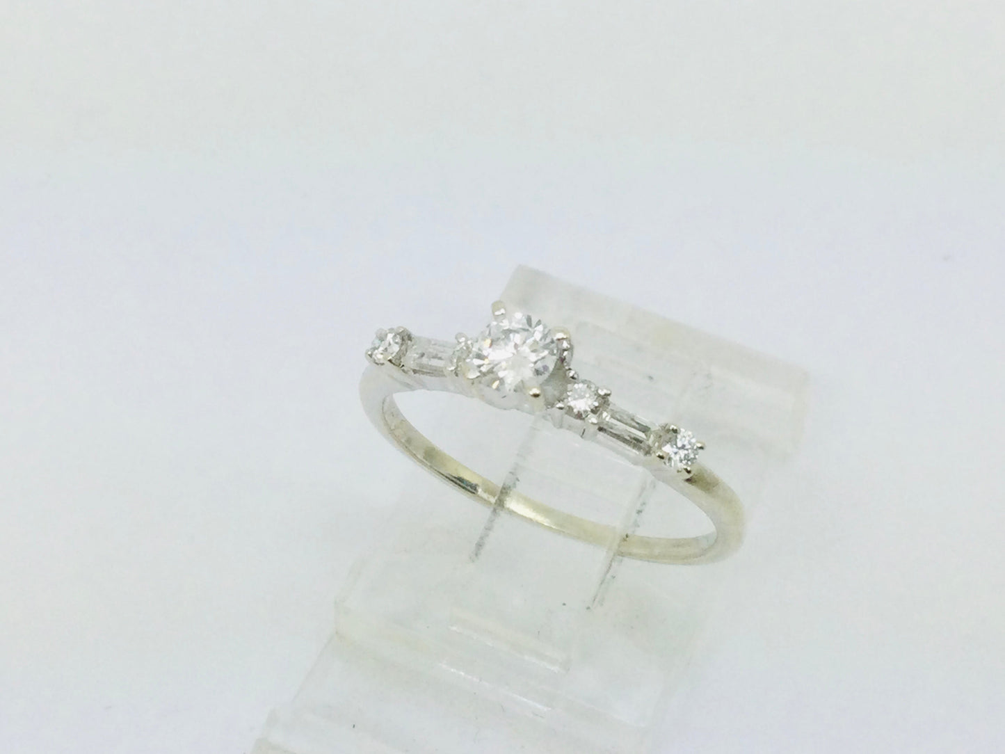 14k White Gold Round Cut 23pt Diamond with Round and Baguette Diamond Accents Ring