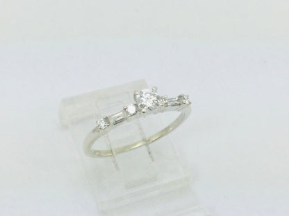 14k White Gold Round Cut 23pt Diamond with Round and Baguette Diamond Accents Ring