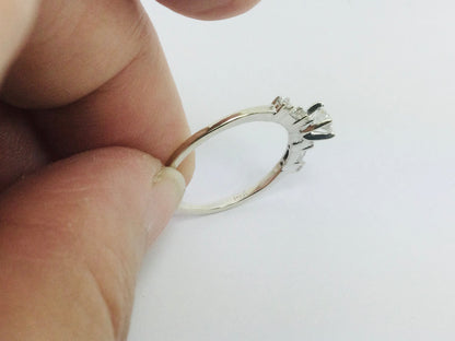 14k White Gold Round Cut 23pt Diamond with Round and Baguette Diamond Accents Ring
