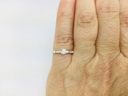 14k White Gold Round Cut 23pt Diamond with Round and Baguette Diamond Accents Ring