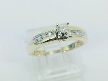 10k Yellow Gold Round Cut 7.5pt Diamond Solitaire with Accents Ring