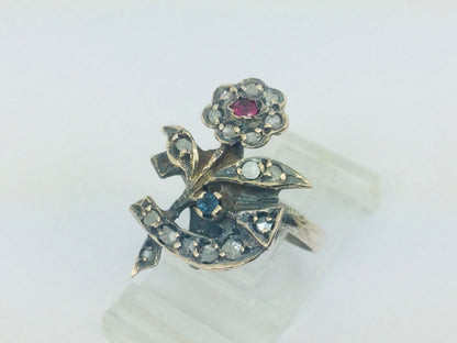 10k Yellow Gold Round Cut 22pt Diamond, 5pt Ruby, and 5pt Blue Topaz Flower Ring